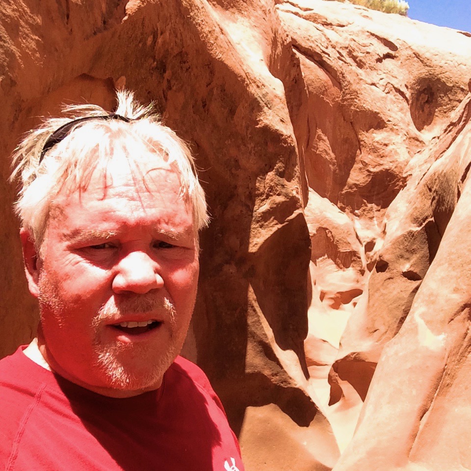 Shows me enjoying the exploring the slot canyons.  